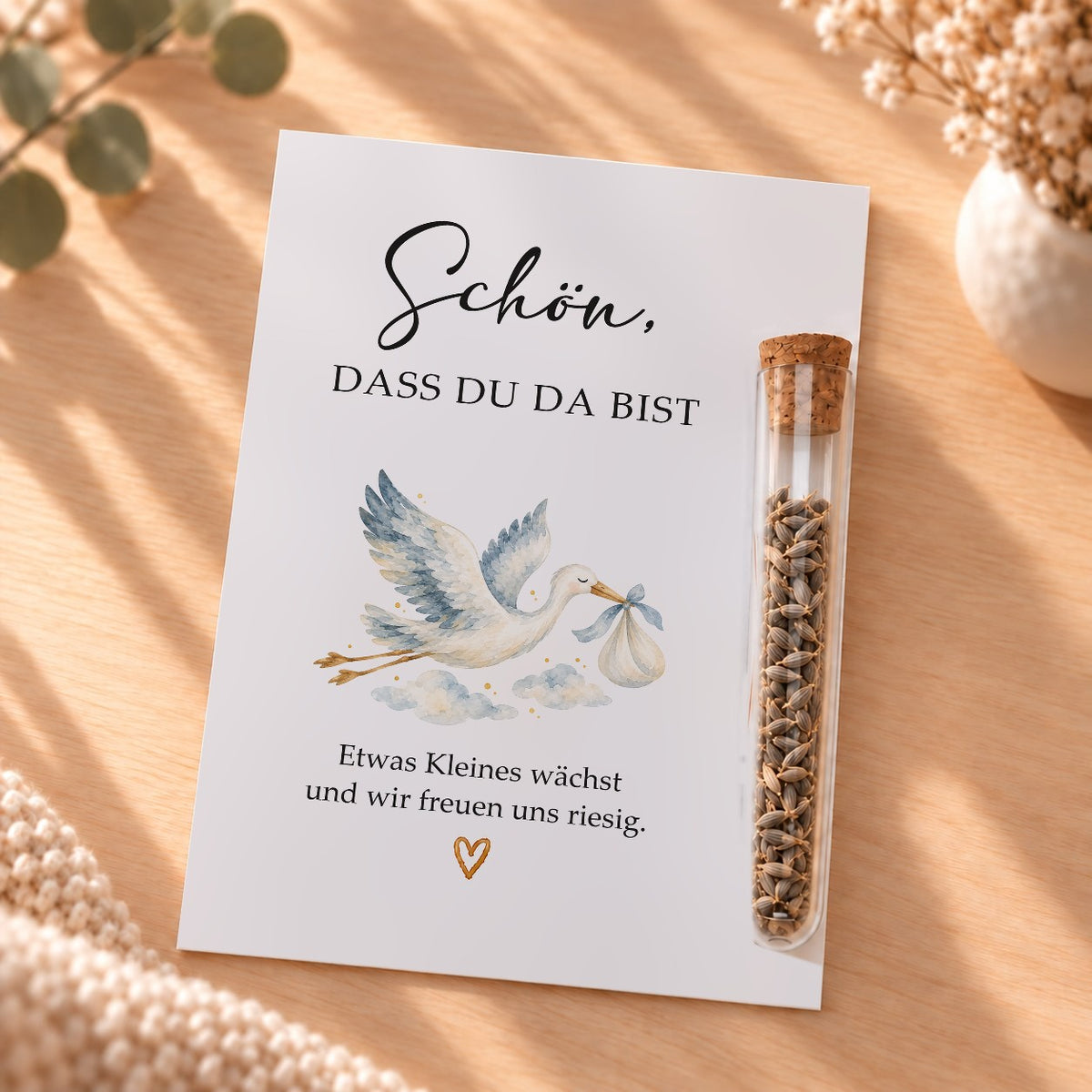 Gastgeschenk für die Babyparty mit Blumensamen: Karte mit Storch und Röhrchen