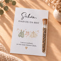 Gastgeschenk für die Babyparty mit Blumensamen: Karte mit Wäscheleine und Röhrchen