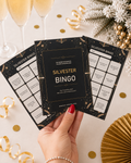 Drei schwarze Silvester-Bingo-Karten als Partyspiel für den Jahreswechsel